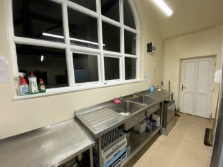 The commercial-style kitchen at Horton Village Hall is fitted with a range of appliances. Pictured is the sink and dishwasher.