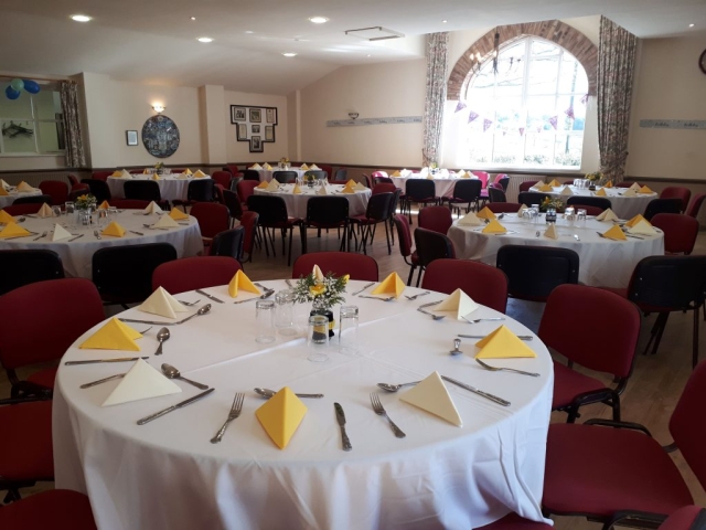 Image showing the main hall at Horton Village Hall laid out with the large round tables for a Birthday party.